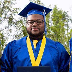 Headshot of Ki'Jay Randall wearing graduation outfit.