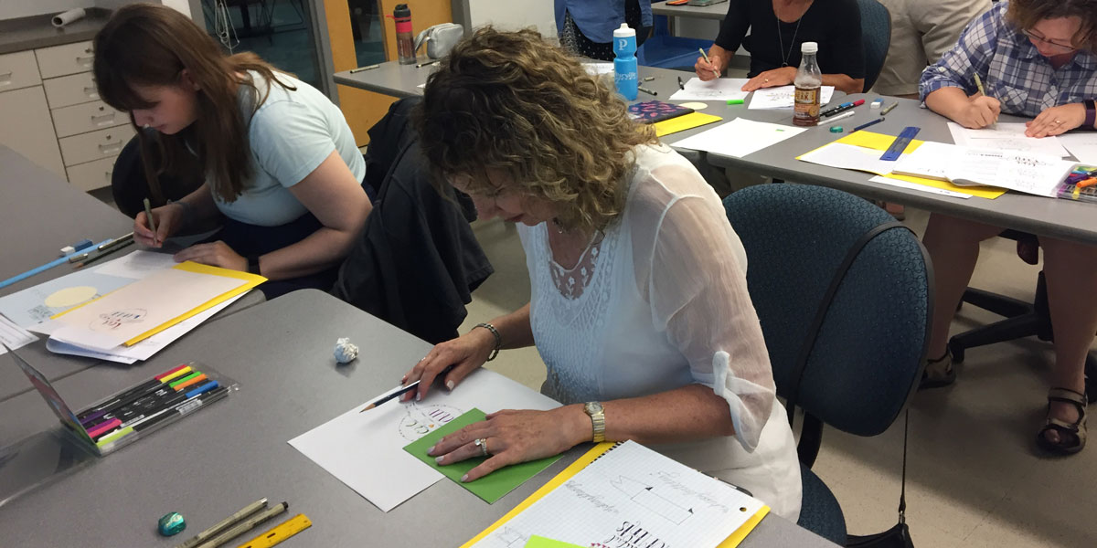 AACC Students participating in a creative lettering class.