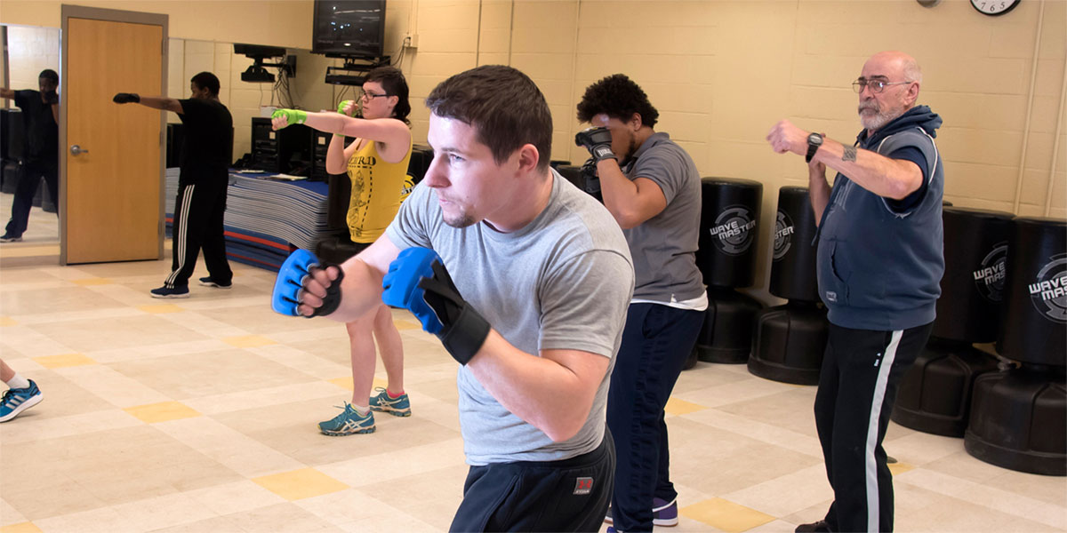 Kickboxing student and teacher in class