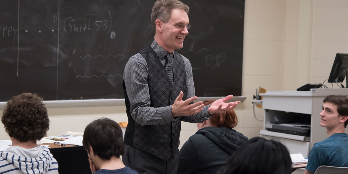 Teacher in classroom with students