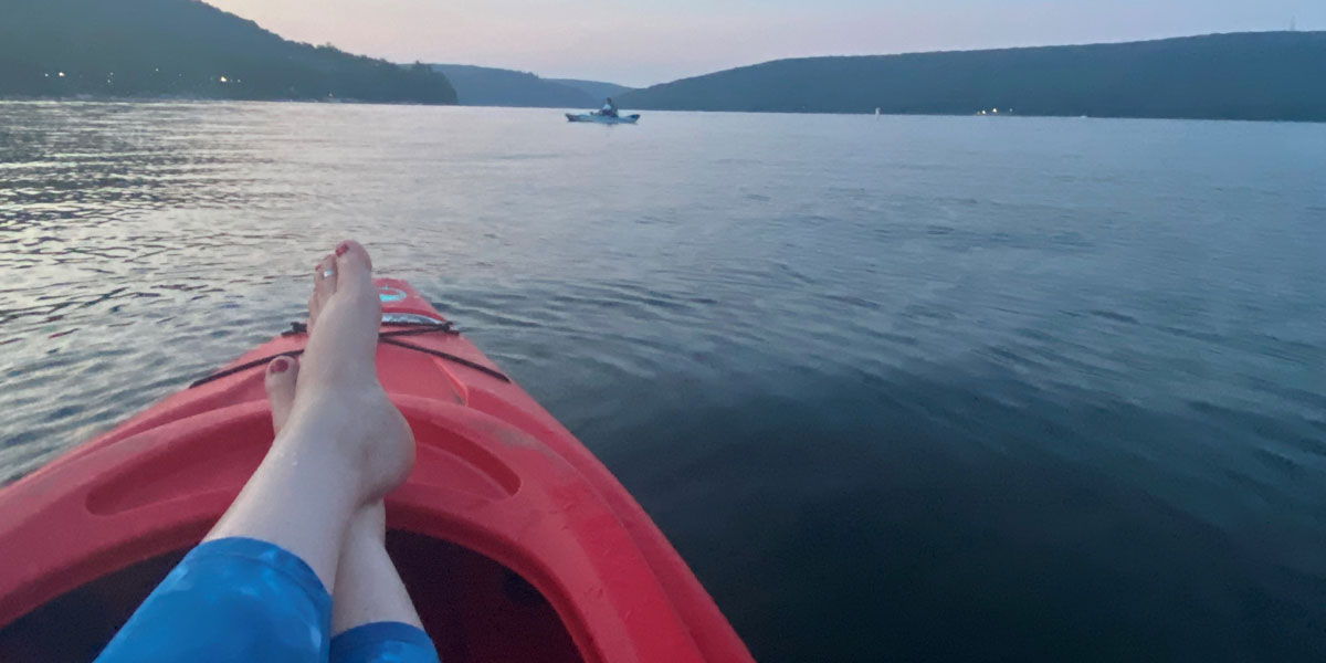 Image of Brandi Shepard in a kayak on the lake.