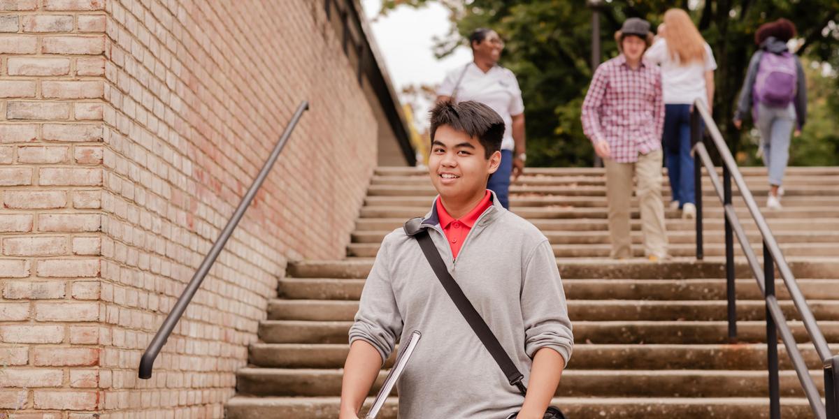 AACC student walking outside at the Arnold campus.