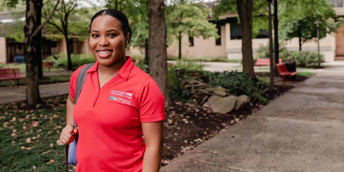 AACC student posing outside of library.