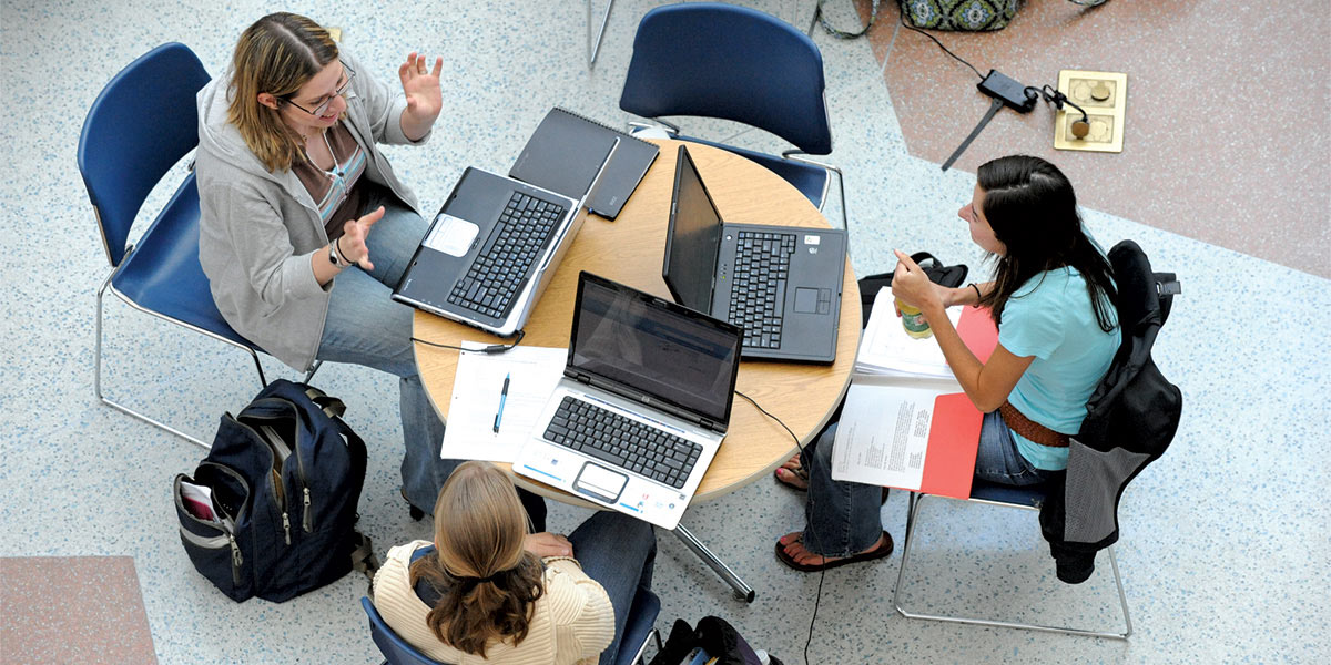 AACC students discuss their studies in the CALT atrium.