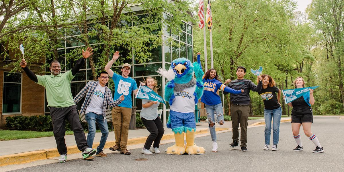 AACC students posing outside with Swoop.